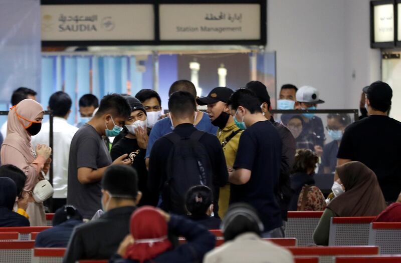 People are seen at a temporary crisis centre organised in the domestic terminal of Soekarno-Hatta International Airport, after Sriwijaya Air plane flight SJ182 lost contact after taking off, in Tangerang, near Jakarta, Indonesia. REUTERS