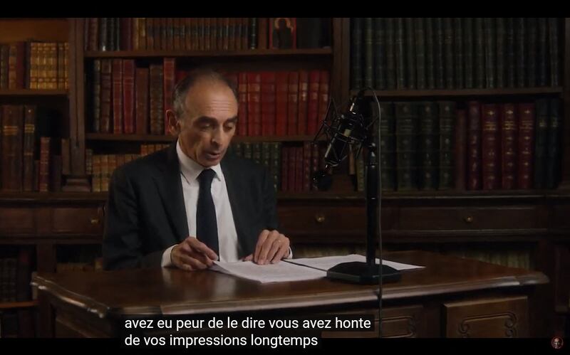 Eric Zemmour spoke from behind an old-fashioned microphone in a nostalgia-filled campaign launch video. AFP