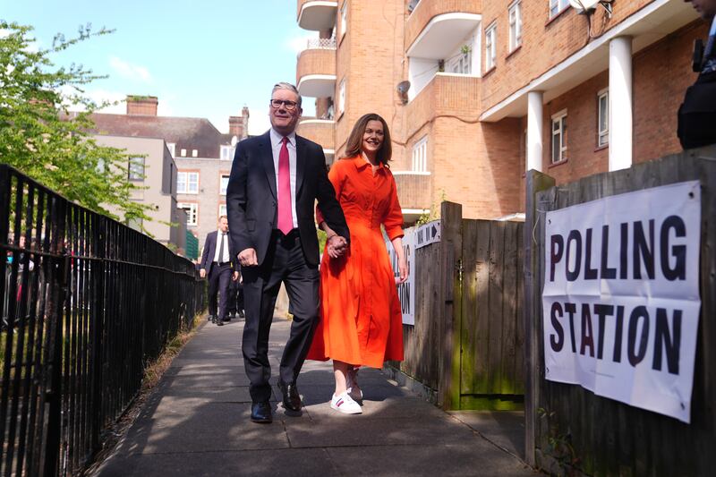 Labour leader Keir Starmer and his wife, Victoria, arrive to cast their votes in Camden, north London. PA