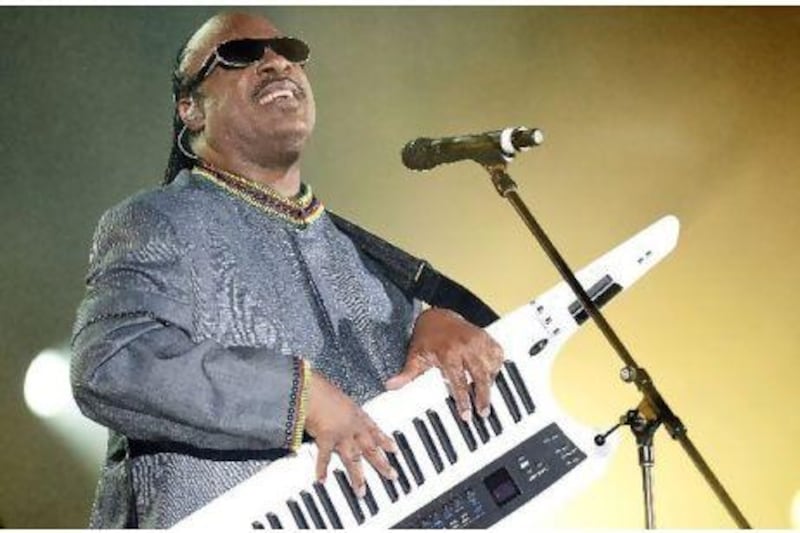 The 60-year-old showman at one point writhed on the stage floor playing an electric "keytar" to the delight of the crowd