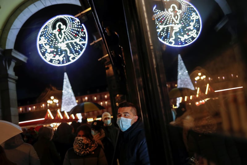 People visit a Christmas market at Plaza Mayor in the Spanish capital. Reuters