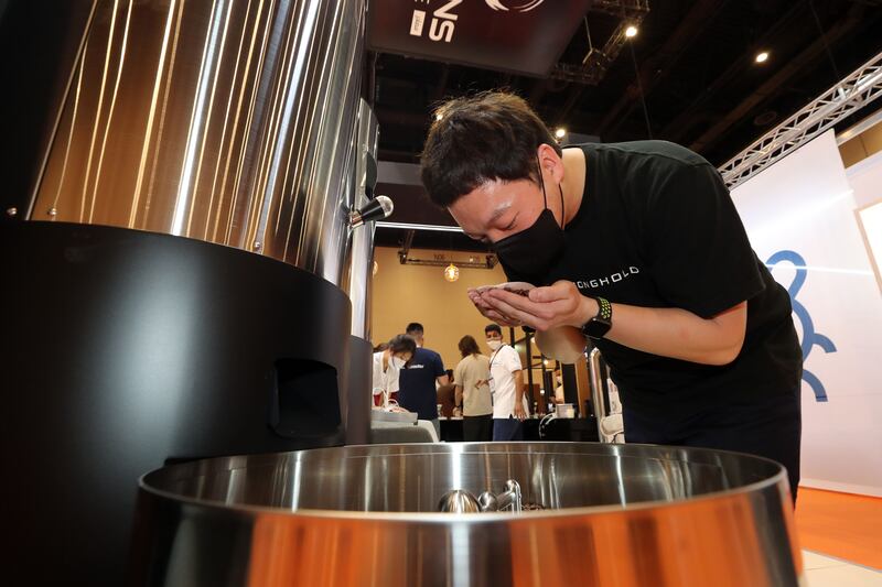 Yphan Lee checks coffee beans after being in a roaster.