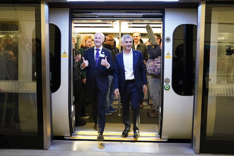 Mayor of London Sadiq Khan and Andy Byford, commissioner at local government body Transport for London disembark the first Elizabeth line train to carry passengers, at Farringdon station, London. PA