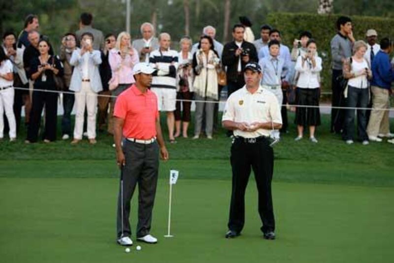 Tiger Woods and Lee Westwood before the start of Challenge Match at the Emirates Golf Club in Dubai.
