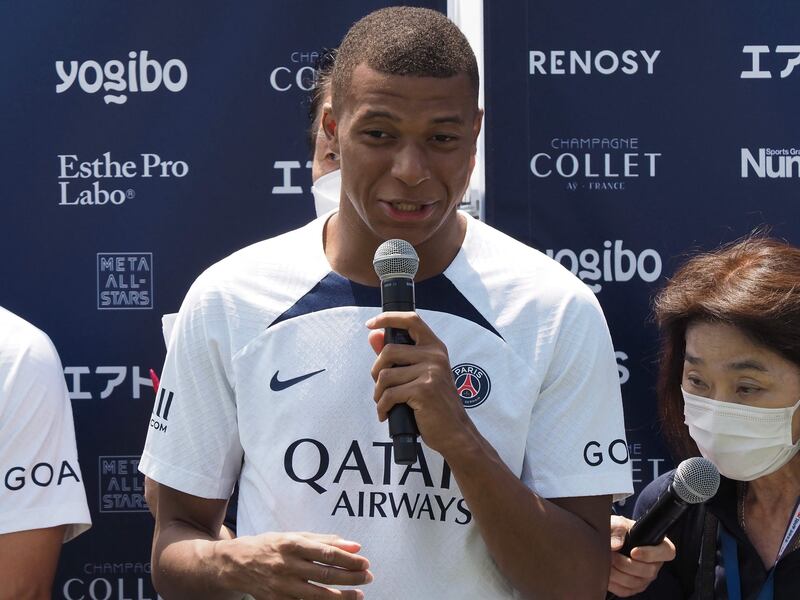 Paris Saint-Germain player Kylian Mbappe speaks during a soccer clinic at a stadium in Tokyo. AFP