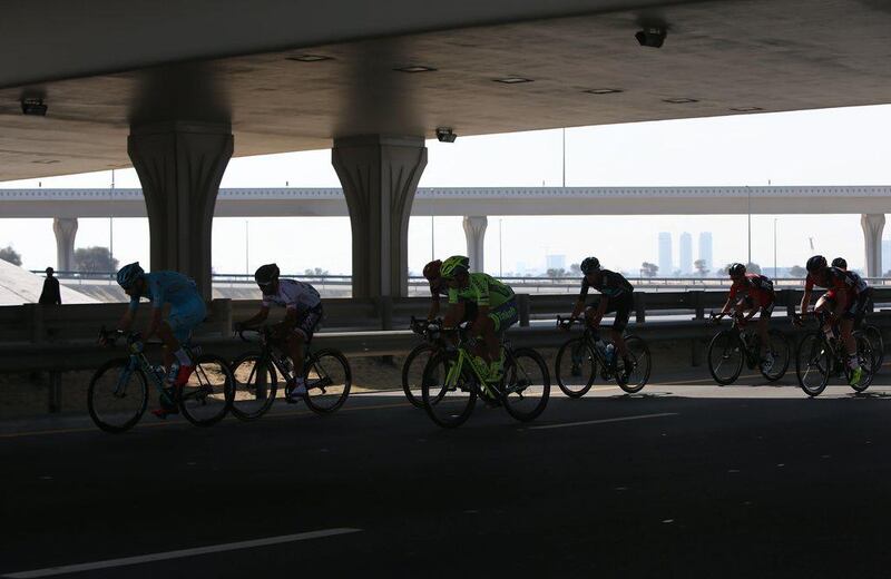 Cyclists compete during the first stage of the Dubai Tour 2016 on February 03, 2016 in Dubai.       / AFP / MARWAN NAAMANI