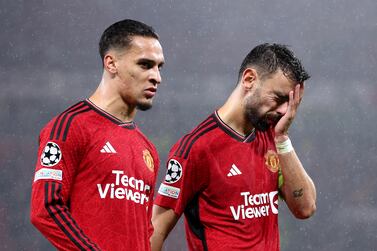 MANCHESTER, ENGLAND - OCTOBER 03: Antony and Bruno Fernandes of Manchester United look dejected following the team's defeat during the UEFA Champions League match between Manchester United and Galatasaray A.S at Old Trafford on October 03, 2023 in Manchester, England. (Photo by Alex Livesey / Getty Images)