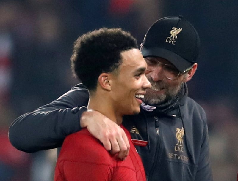 Soccer Football - Premier League - Liverpool v Watford - Anfield, Liverpool, Britain - February 27, 2019  Liverpool manager Juergen Klopp and Liverpool's Trent Alexander-Arnold celebrate after the match          Action Images via Reuters/Carl Recine  EDITORIAL USE ONLY. No use with unauthorized audio, video, data, fixture lists, club/league logos or "live" services. Online in-match use limited to 75 images, no video emulation. No use in betting, games or single club/league/player publications.  Please contact your account representative for further details.