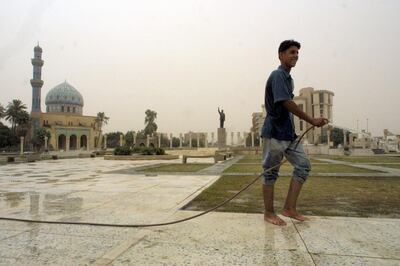 An Iraqi boy cleans the Al Fardous square in Baghdad, in October 2002. AFP