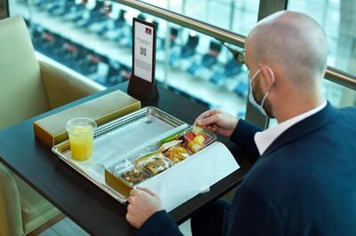 Food in the lounge is now offered in hygienically sealed meal boxes. Courtesy Emirates