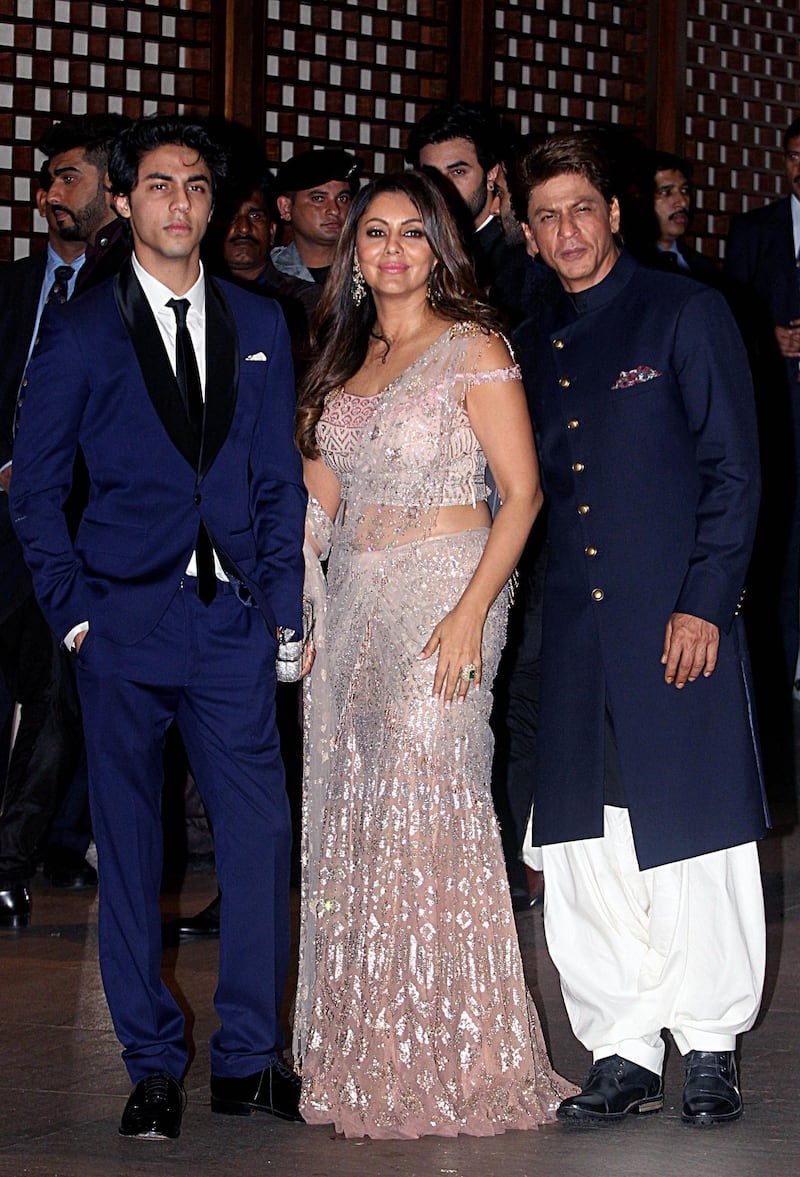 Indian Bollywood actor Shah Rukh Khan (R) with his wife Gauri Khan and son Aryan Khan on Saturday night. AFP