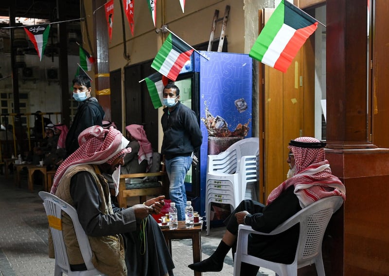 Customers relax at a coffee shop at Kuwait City's Souk Al-Mubarakiya. EPA