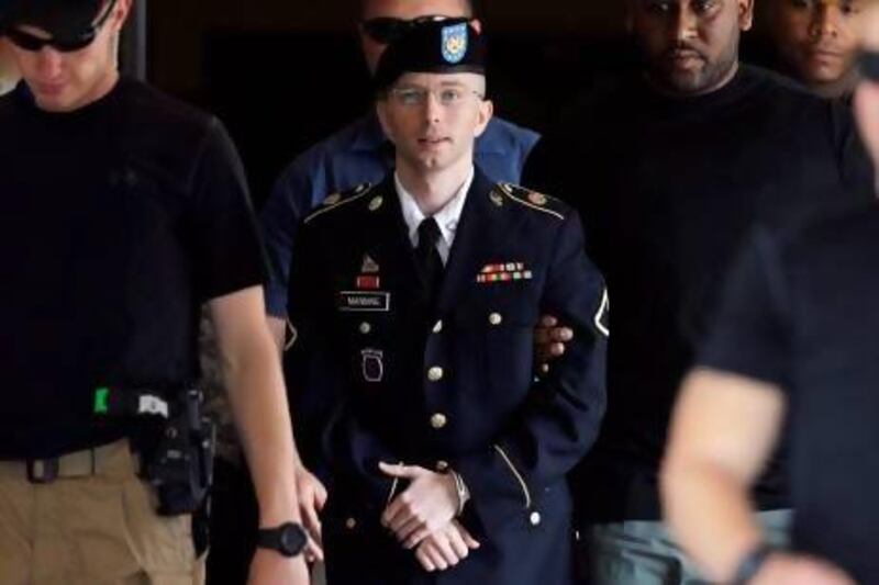 Manning is escorted out of a Fort Meade courthouse during the sentencing phase of his court-martial for leaking military and diplomatic secrets.
