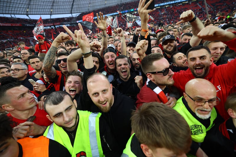 Bayer Leverkusen fans celebrating after the game. Reuters 