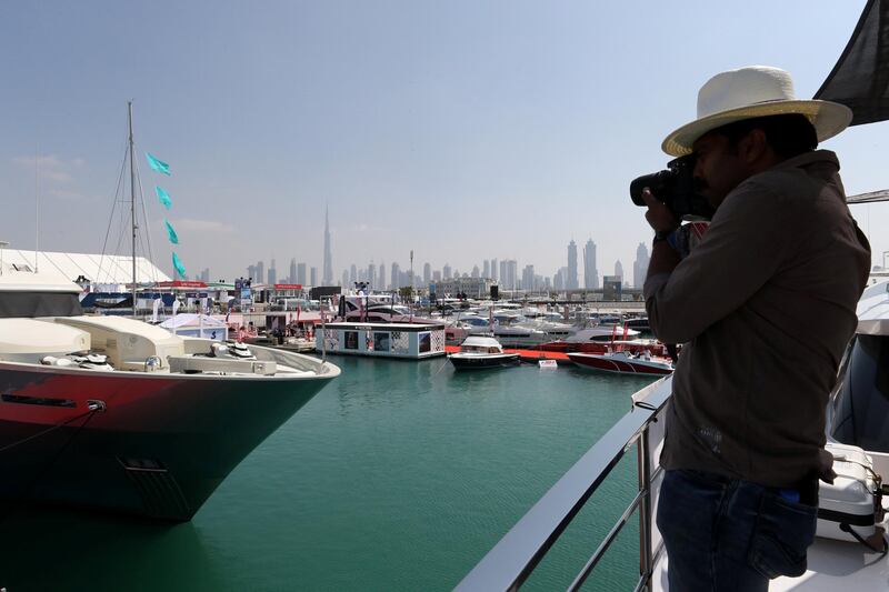 DUBAI , UNITED ARAB EMIRATES , February 26 – 2019 :- Visitors taking photos of different types of boats and yachts at the Dubai International Boat Show held in Dubai. ( Pawan Singh / The National ) For News/Instagram/Big Picture. Story by Nick Webster