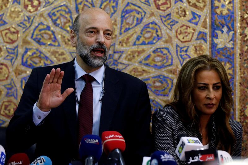 FILE PHOTO: Jordan's Prime Minister Omar al-Razzaz and Minister of State for Media Affairs Jumana Ghunaimat arrive for their news conference in Amman, Jordan June 19, 2018. REUTERS/Muhammad Hamed/File Photo