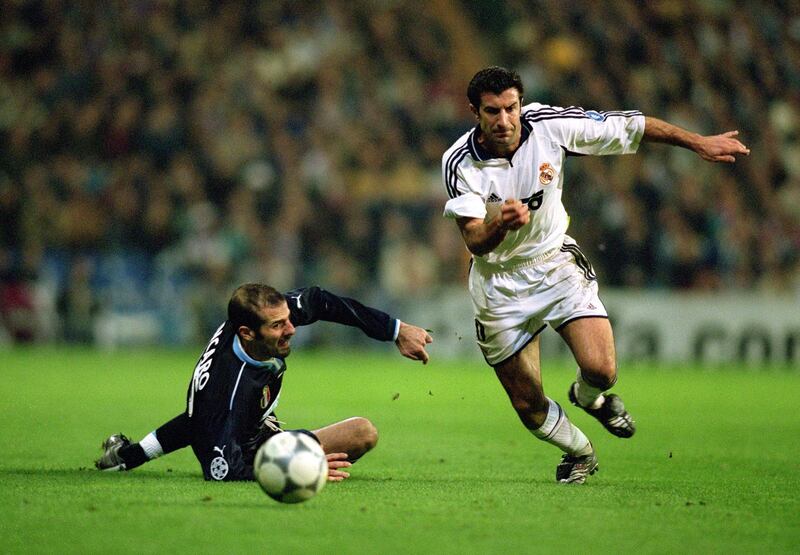 13 Feb 2001:  Luis Figo of Real Madrid leaves Giuseppe Pancaro of Lazio on the floor as he goes on another mazy dribble during the UEFA Champions League Group D match played at the Santiago Bernabeau, in Madrid, Spain. Real Madrid won the match 3-2. \ Mandatory Credit: Gary M Prior/Allsport
