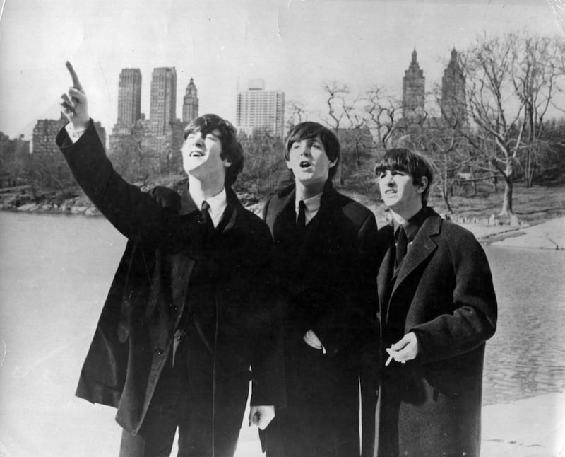10th February 1964:  Beatlemania has hit big in New York. John Lennon (1940 - 1980), Paul McCartney and Ringo Starr, from left to right, enjoy a few moments away from the screaming fans when police smuggled them out of the side door of their hotel for a visit to New York's Central Park.  (Photo by Keystone/Getty Images)