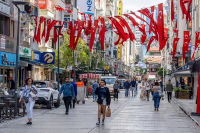 Turkish national flag bunting hangs above a street in Izmir, Turkey, on Friday. Bloomberg