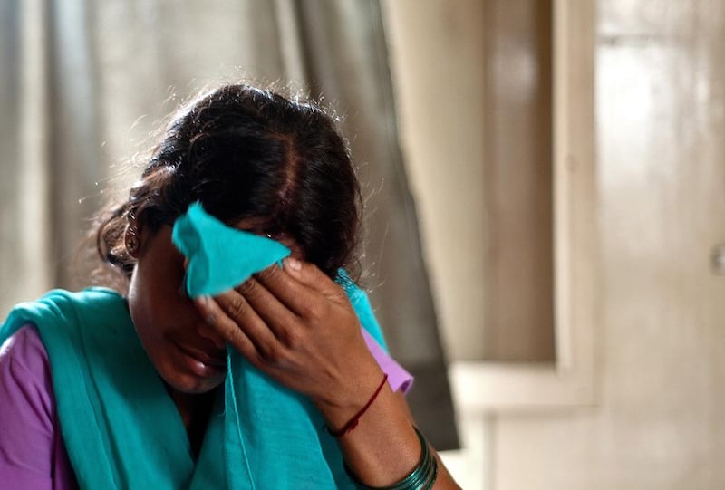 This alleged victim of human-trafficking in India weeps after being rescued from a village in Karnal about 100 kms from New Delhi. Mana Vatsyayana / AFP 