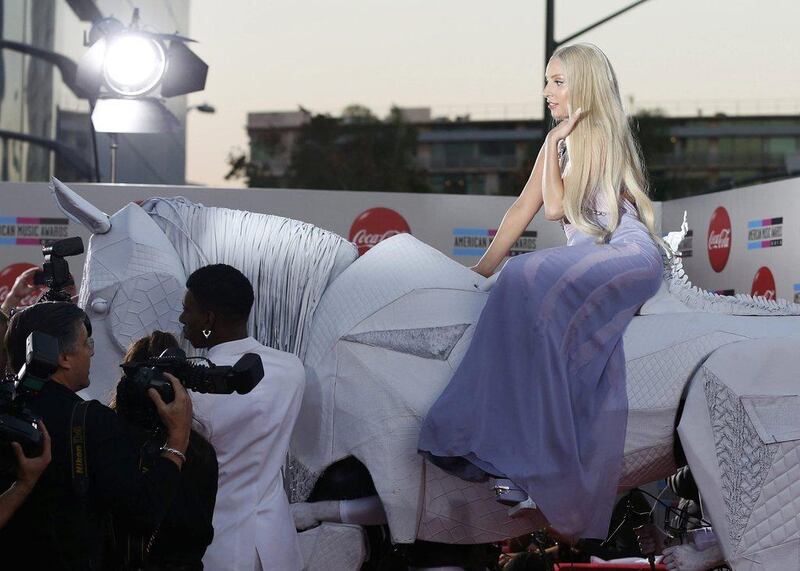Musician Lady Gaga arrives with a mechanical horse at the 41st American Music Awards in Los Angeles, California. Mario Anzouni / Reuters
