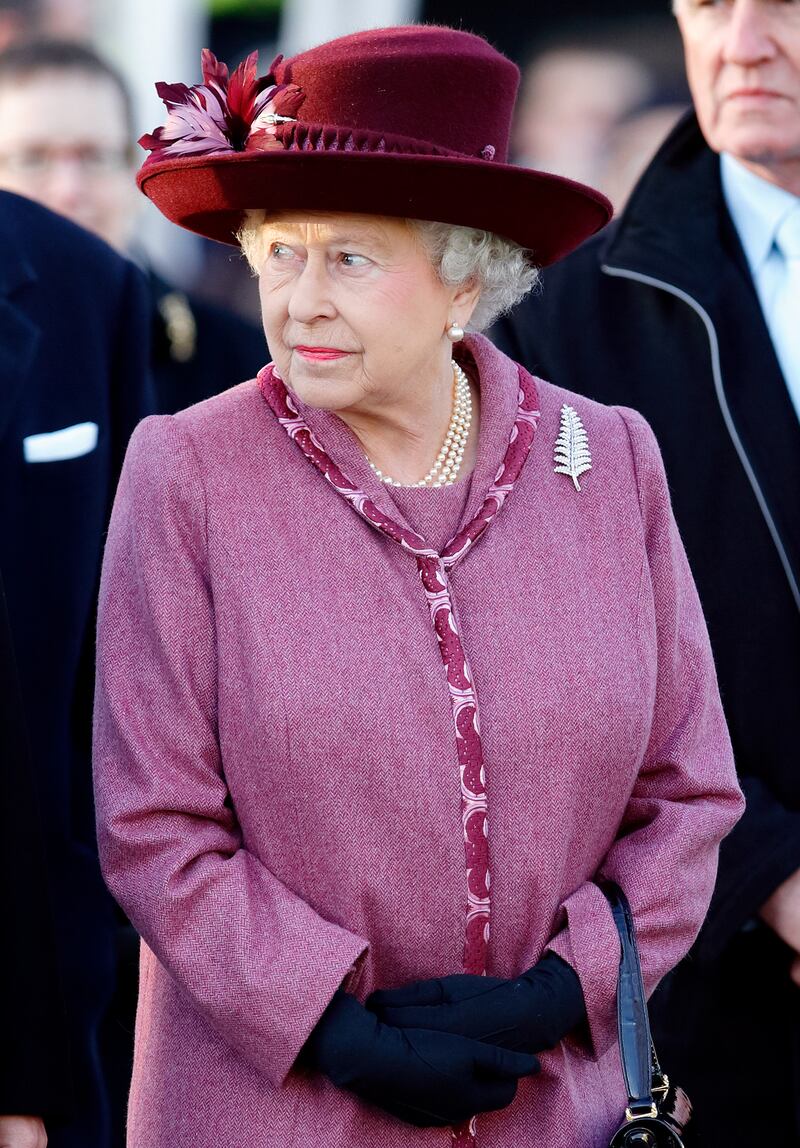 Queen Elizabeth II wears the New Zealand silver fern brooch, given to her in 1953, during a New Zealand tourism exhibition in November 2008 in London. Getty Images