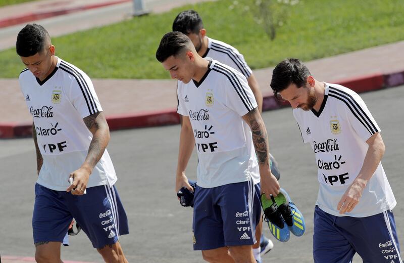 Lionel Messi, right, Cristian Pavon, centre, and Marco Rojo, left, arrive for a training session in Bronnitsy. Lavandeira / EPA