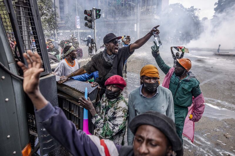 Kenyan protesters chant anti-government slogans during a nationwide strike to demonstrate against tax hikes and a finance bill in downtown Nairobi. AFP