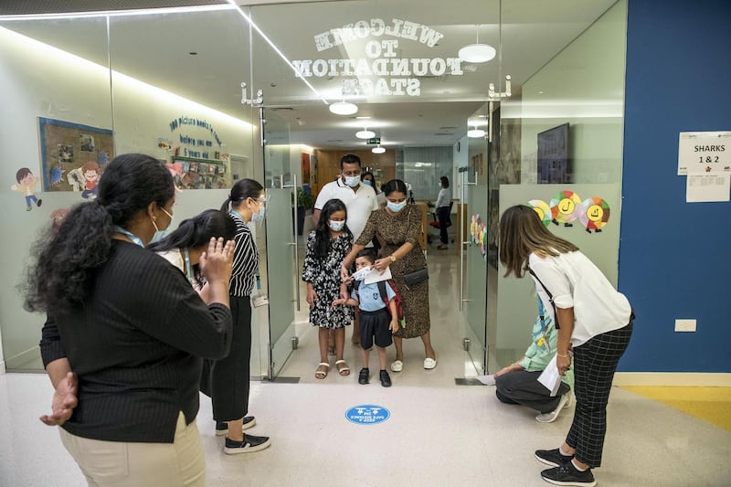 DUBAI, UNITED ARAB EMIRATES. 30 AUGUST 2020. STANDALONE. First day of school. Gems Wellington Academy in Al Khail opens for the start of the school year. Naividh Pillai (3) arrives with his sister Alaikha along with thier parents Meera and Deepesh. (Photo: Antonie Robertson/The National) Journalist: Anna Zacharias. Section: National.