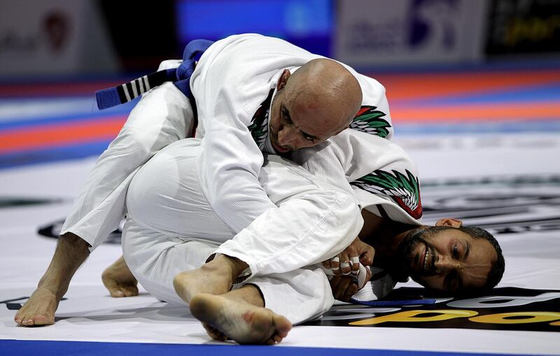 Abu Dhabi, April 17, 2018: ( L -Red) Mohamad Khamees Mohamad and ( R-White ) Mohamad Al Amri compete in the 58KG Finals Bronze Match  during the Abu Dhabi World Proffessional Jiu JitsuChampionship 2018 at the Zayed Sports in Abu Dhabi. Satish Kumar for the National / Story by Amit Pasella