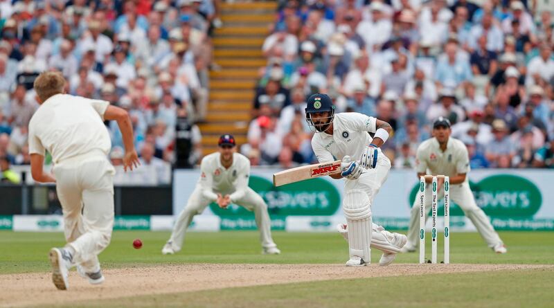 India's Virat Kohli (C) plays a shot during the third day of the first Test cricket match between England and India at Edgbaston in Birmingham, central England on August 3, 2018. 
 / AFP PHOTO / ADRIAN DENNIS / RESTRICTED TO EDITORIAL USE. NO ASSOCIATION WITH DIRECT COMPETITOR OF SPONSOR, PARTNER, OR SUPPLIER OF THE ECB