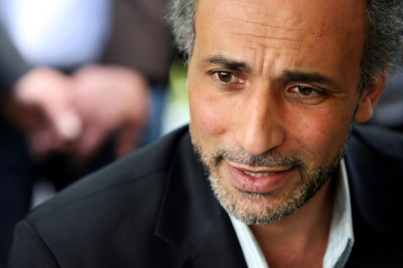 FILE PHOTO: Author Tariq Ramadan talks with a journalist after a conference at the Er-Rahma mosque in Nantes, France, April 25, 2010. Ramadan, a professor of Islamic studies at the University of Oxford, has been taken into custody by French police following accusations of rape, according to a judicial source, January 31, 2018.  Picture taken April 25, 2010.    REUTERS/Stephane Mahe/File Photo