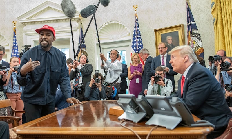 Kanye West talks with President Donald Trump in the White House's Oval Office on October 11, 2018. Getty Images