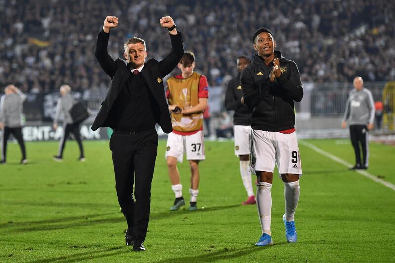 Ole Gunnar Solskjaer and Anthony Martial celebrate Manchester United's long-awaited away win during their Europa League group L match against Partizan Belgrade. AFP