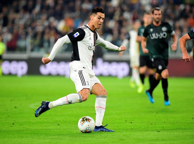 Soccer Football - Serie A - Juventus v Bologna - Allianz Stadium, Turin, Italy Juventus' Cristiano Ronaldo scores their first goal. REUTERS