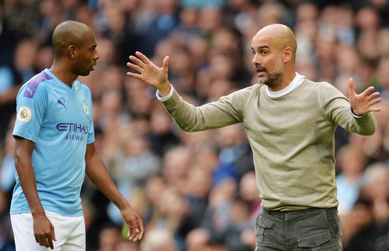 epa07901487 Manchester City manager Pep Guardiola (R) talks to player Fernandinho during the English Premier League soccer match between Manchester City and Wolverhampton Wanderers at the Etihad Stadium, Manchester, Britain, 06 October 2019.  EPA/PETER POWELL EDITORIAL USE ONLY. No use with unauthorized audio, video, data, fixture lists, club/league logos or 'live' services. Online in-match use limited to 120 images, no video emulation. No use in betting, games or single club/league/player publications