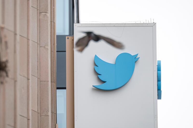 A bird flies near signage displayed outside of Twitter headquarters in San Francisco, California, U.S., on Thursday, July 16, 2020. As Twitter Inc. grapples with the worst security breach in its 14-year history, it must now uncover whether its employees were victims of sophisticated phishing schemes or if they deliberately allowed hackers to access high-profile accounts. Photographer: David Paul Morris/Bloomberg