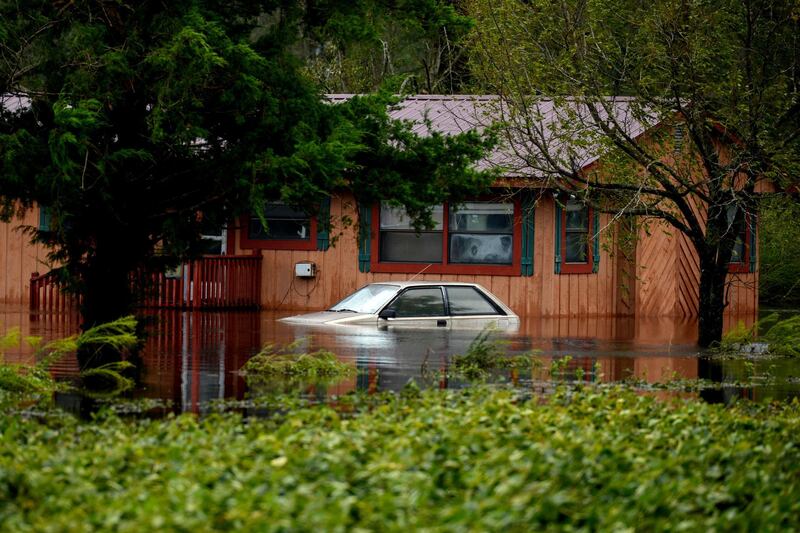 A car stands partially submerged in floodwaters during Tropical Storm Florence near Beulaville, North Carolina. Bloomberg