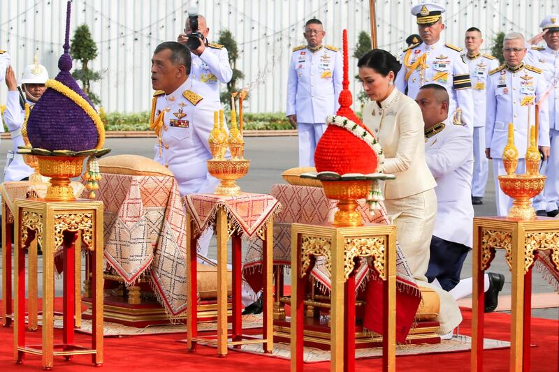 Thailand's King Maha Vajiralongkorn and Queen Suthida pay their respect at the statue of King Rama V.