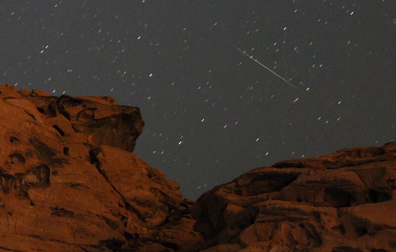 A Perseid meteor above a sandstone outcrop at Redstone in the Pinto Valley wilderness area in Nevada, US.