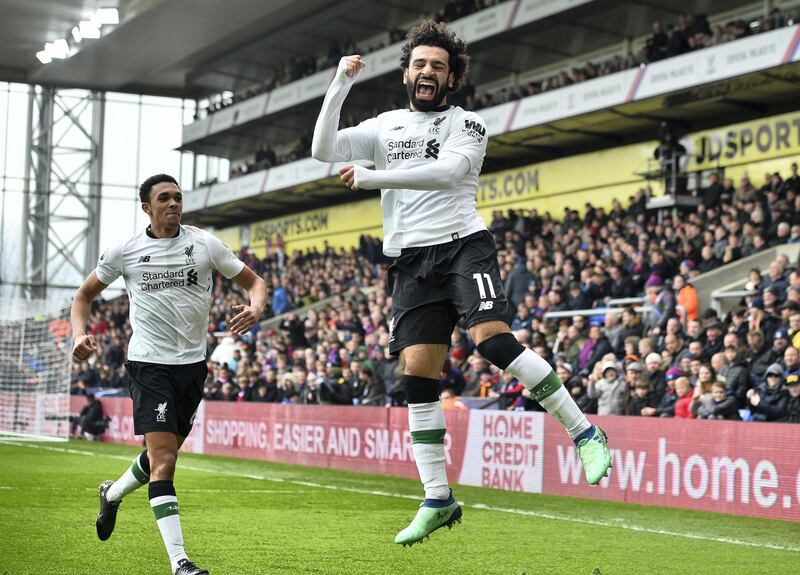 Liverpool's Egyptian midfielder Mohamed Salah celebrates scoring the team's second goal during the English Premier League football match between Crystal Palace and Liverpool at Selhurst Park in south London on March 31, 2018. / AFP PHOTO / Glyn KIRK / RESTRICTED TO EDITORIAL USE. No use with unauthorized audio, video, data, fixture lists, club/league logos or 'live' services. Online in-match use limited to 75 images, no video emulation. No use in betting, games or single club/league/player publications.  / 