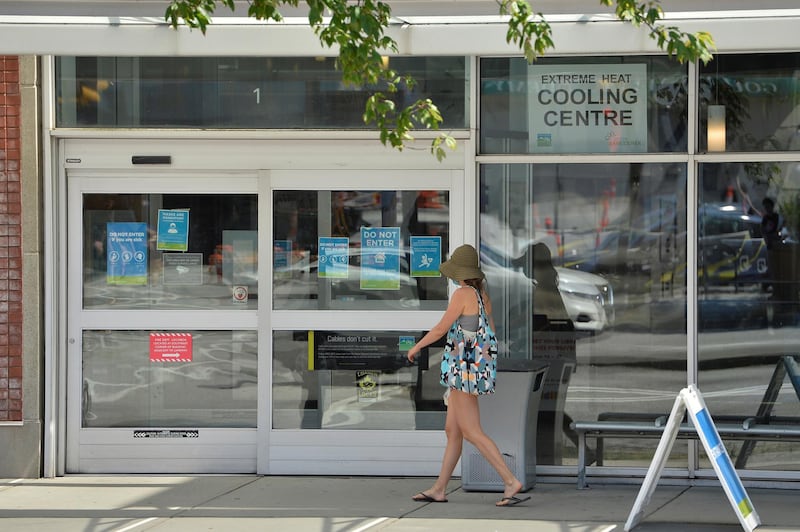 A woman enters a cooling centre during the scorching weather of a heatwave in Vancouver, British Columbia, Canada June 27, 2021. REUTERS/Jennifer Gauthier