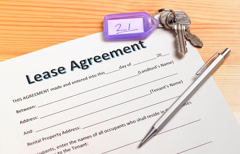 a lease agreement waiting to be signed with house keys