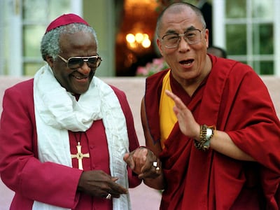 In this file photo, Archbishop Desmond Tutu shares a joke with the Dalai Lama. Reuters