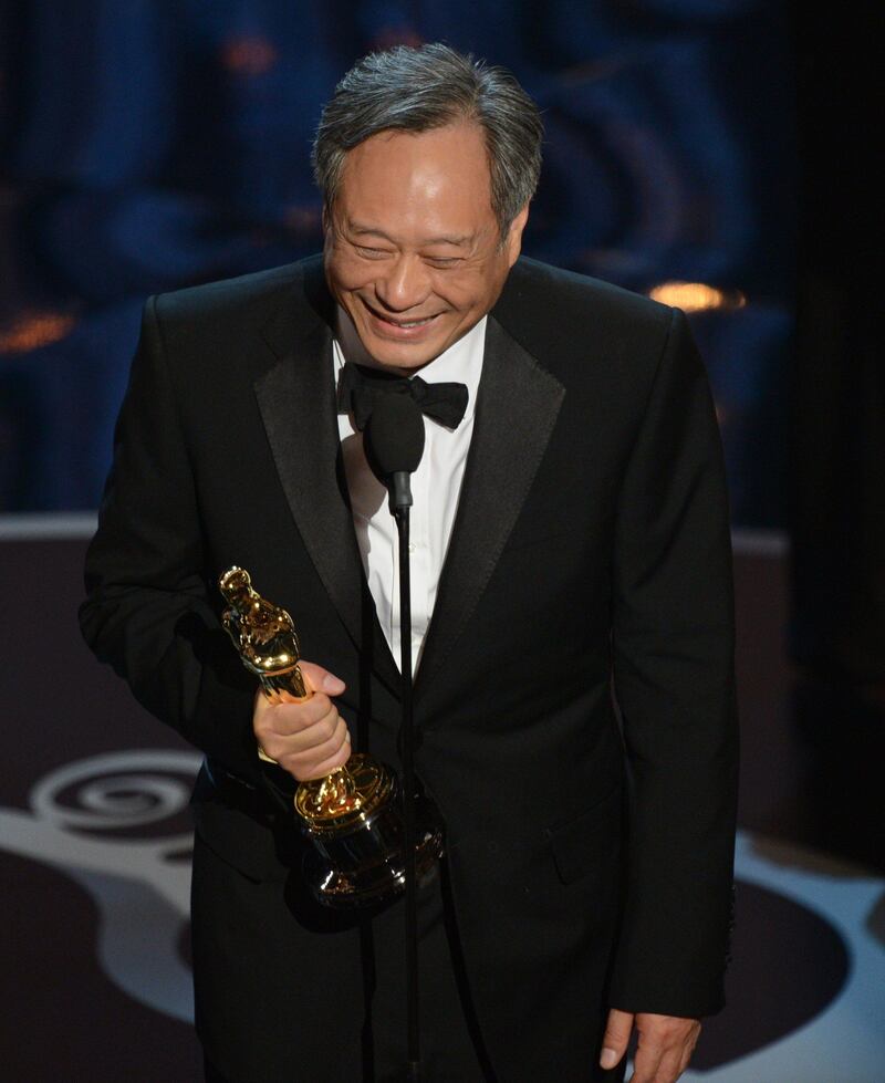 Best Director winner Ang Lee accepts the trophy onstage at the 85th Annual Academy Awards on February 24, 2013 in Hollywood, California. AFP PHOTO/Robyn BECK
 *** Local Caption ***  565245-01-08.jpg