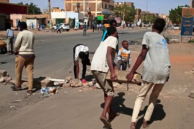 Sudanese demonstrators barricade Al Sahafa street during protests against the military coup in the capital Khartoum. AFP