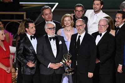 British screenwriter Jesse Armstrong accepts the Emmy Award for Outstanding Drama Series for 'Succession', joined by the show's cast and crew. AFP 