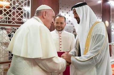 ABU DHABI, UNITED ARAB EMIRATES - February 03, 2019: Day one of the UAE papal visit - HH Sheikh Mohamed bin Zayed Al Nahyan, Crown Prince of Abu Dhabi and Deputy Supreme Commander of the UAE Armed Forces (R), receives His Holiness Pope Francis, Head of the Catholic Church (L), at the Presidential Airport.  ( Mohamed Al Hammadi / Ministry of Presidential Affairs )