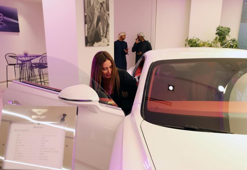 Abu Dhabi, United Arab Emirates - Reporter: Simon Wilgress-Pipe: A visitor gets into a Bentley Continental GT. The opening of the new Bentley Emirates showroom. Tuesday, January 21st, 2020. Abu Dhabi. Chris Whiteoak / The National
