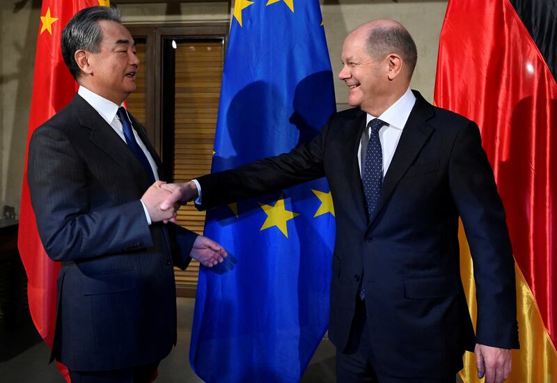 German Chancellor Olaf Scholz and China's top diplomat, Wang Yi, attend a bilateral meeting at the Munich Security Conference earlier this month. Reuters